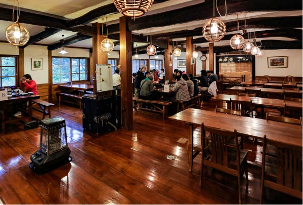 The dining room, featuring impressive wooden beams.