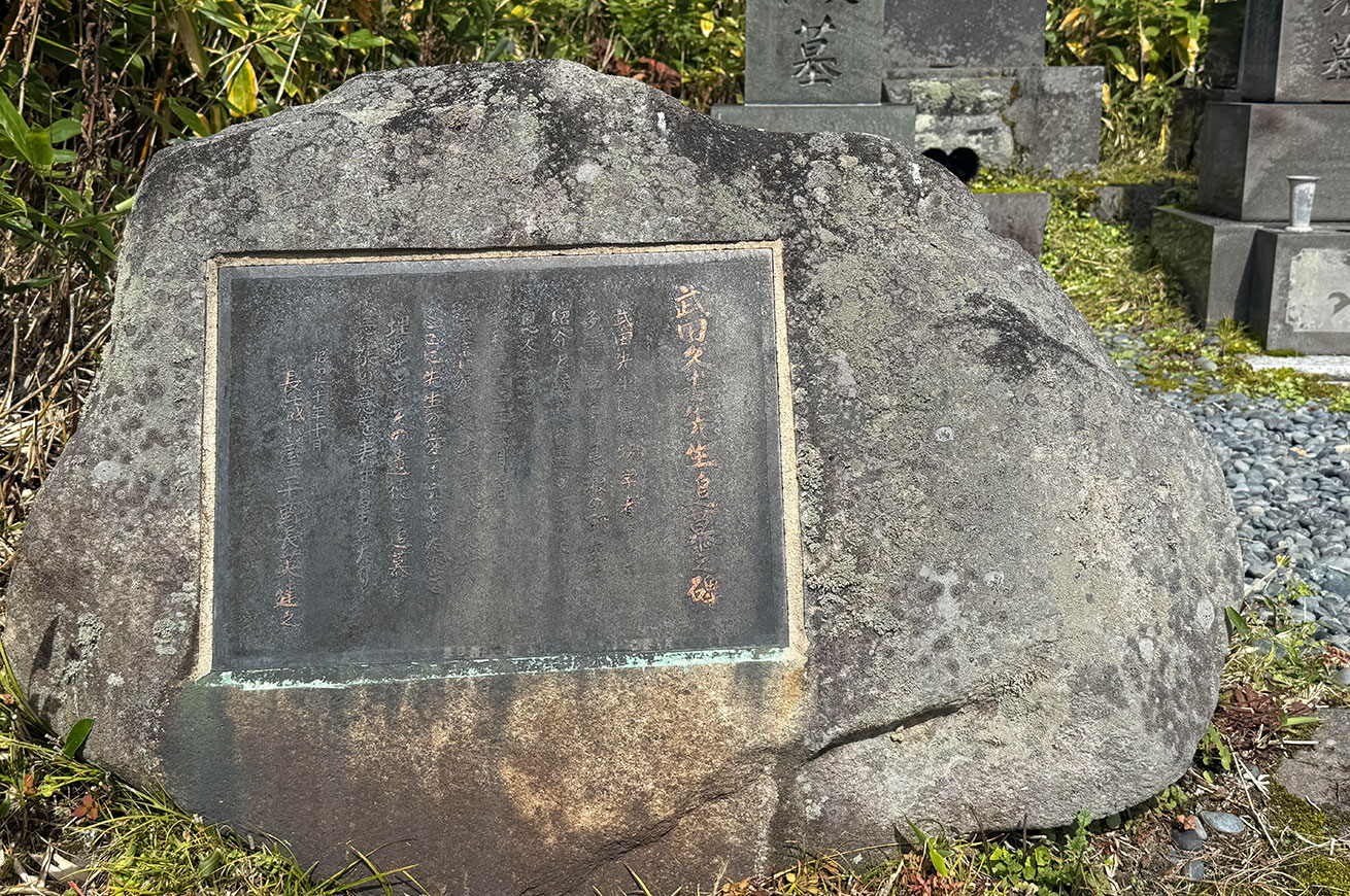 Praying at the memorial marker on the hill of the marshland